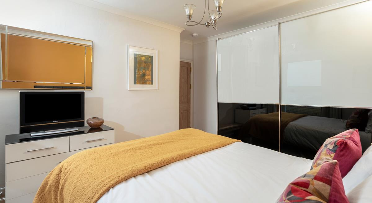 The spacious wardrobe offers plenty of storage.