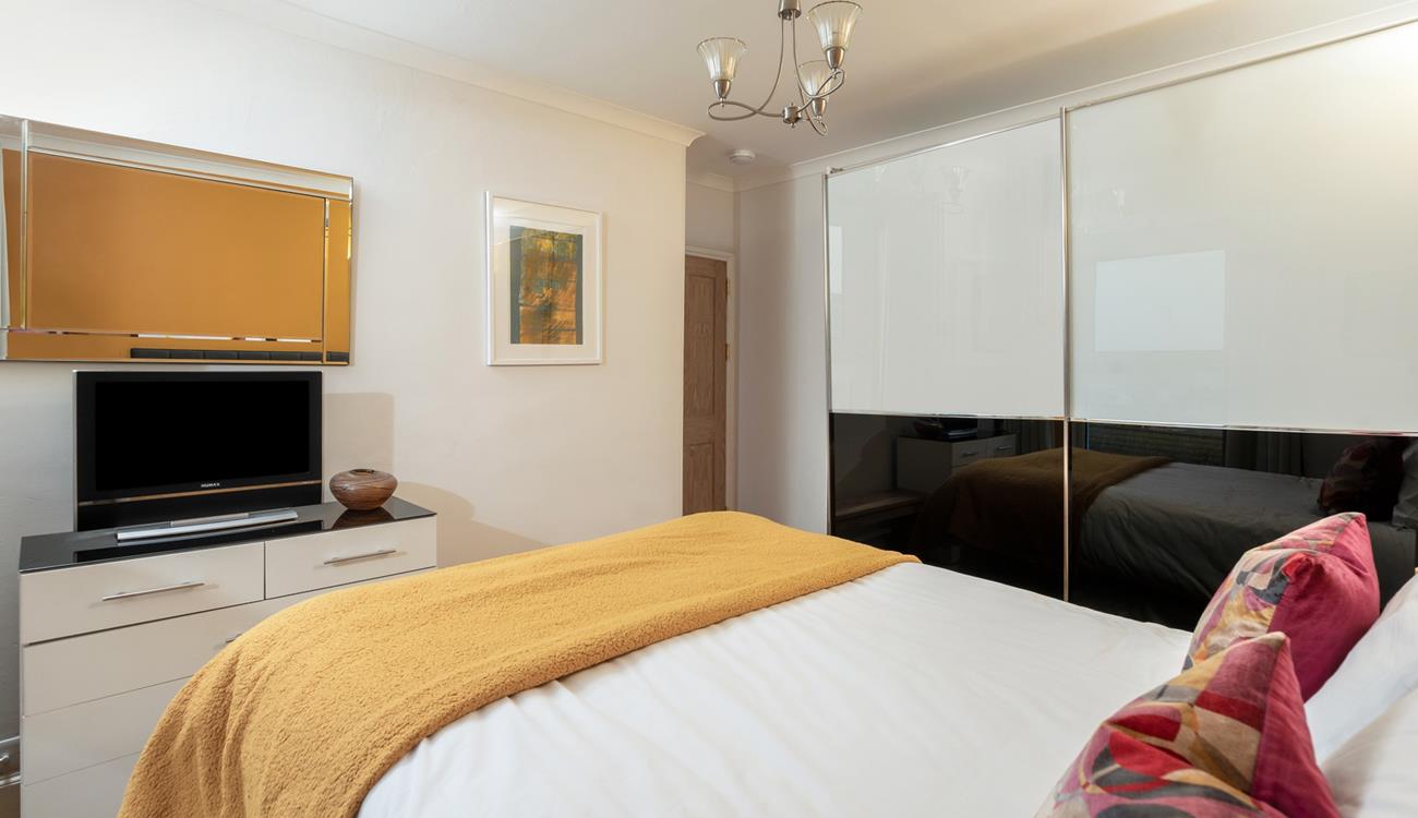 The spacious wardrobe offers plenty of storage.