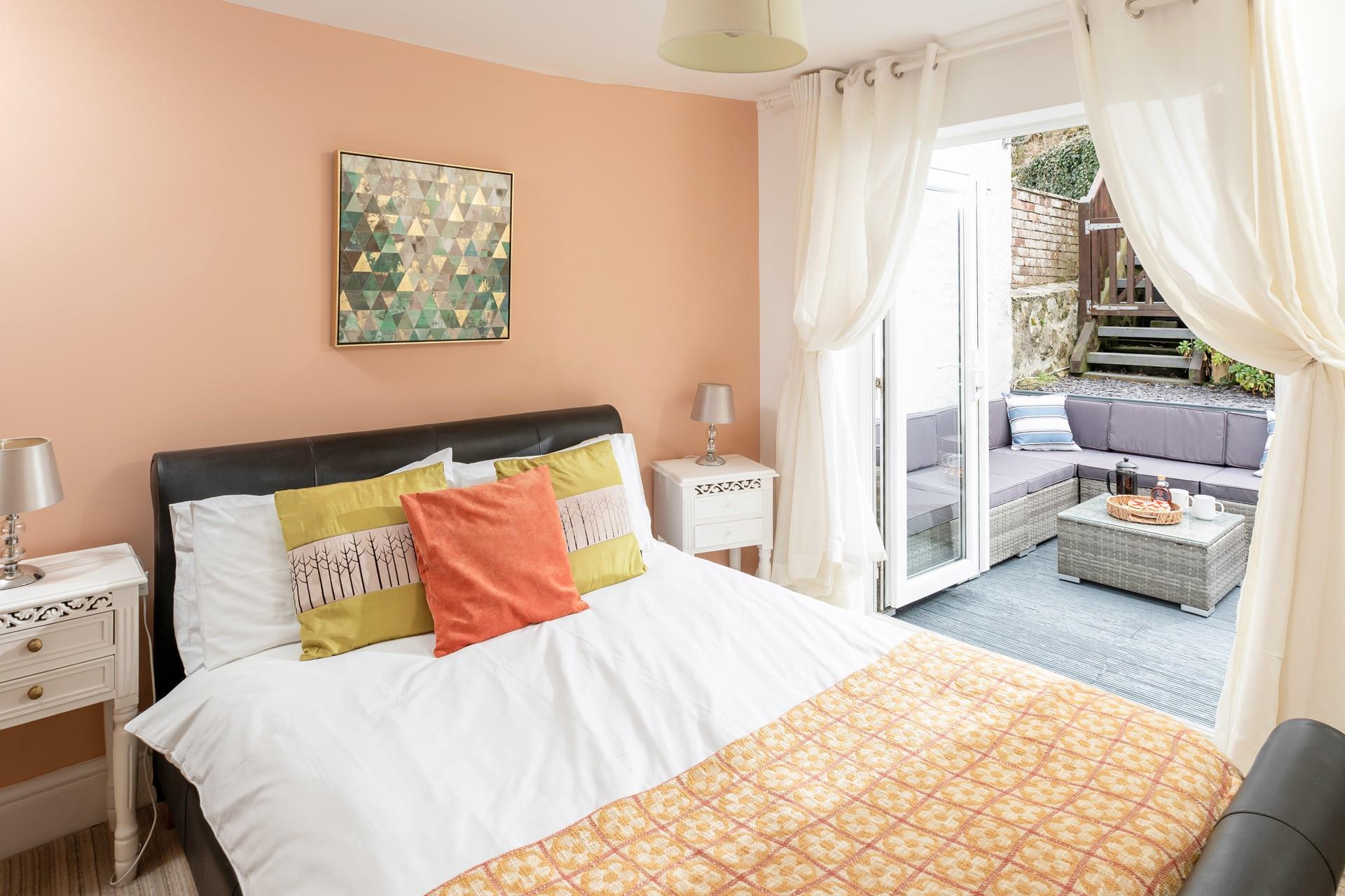 Bedroom 4 has patio doors out to the garden, perfect for a morning coffee in the sun!