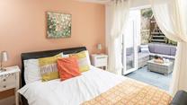 Bedroom 4 has patio doors out to the garden, perfect for a morning coffee in the sun!