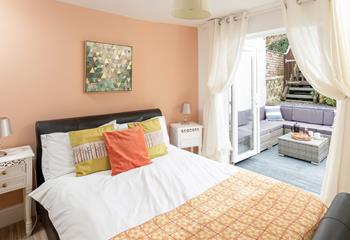 Bedroom 4 has patio doors out to the garden, perfect for a morning coffee in the sun!
