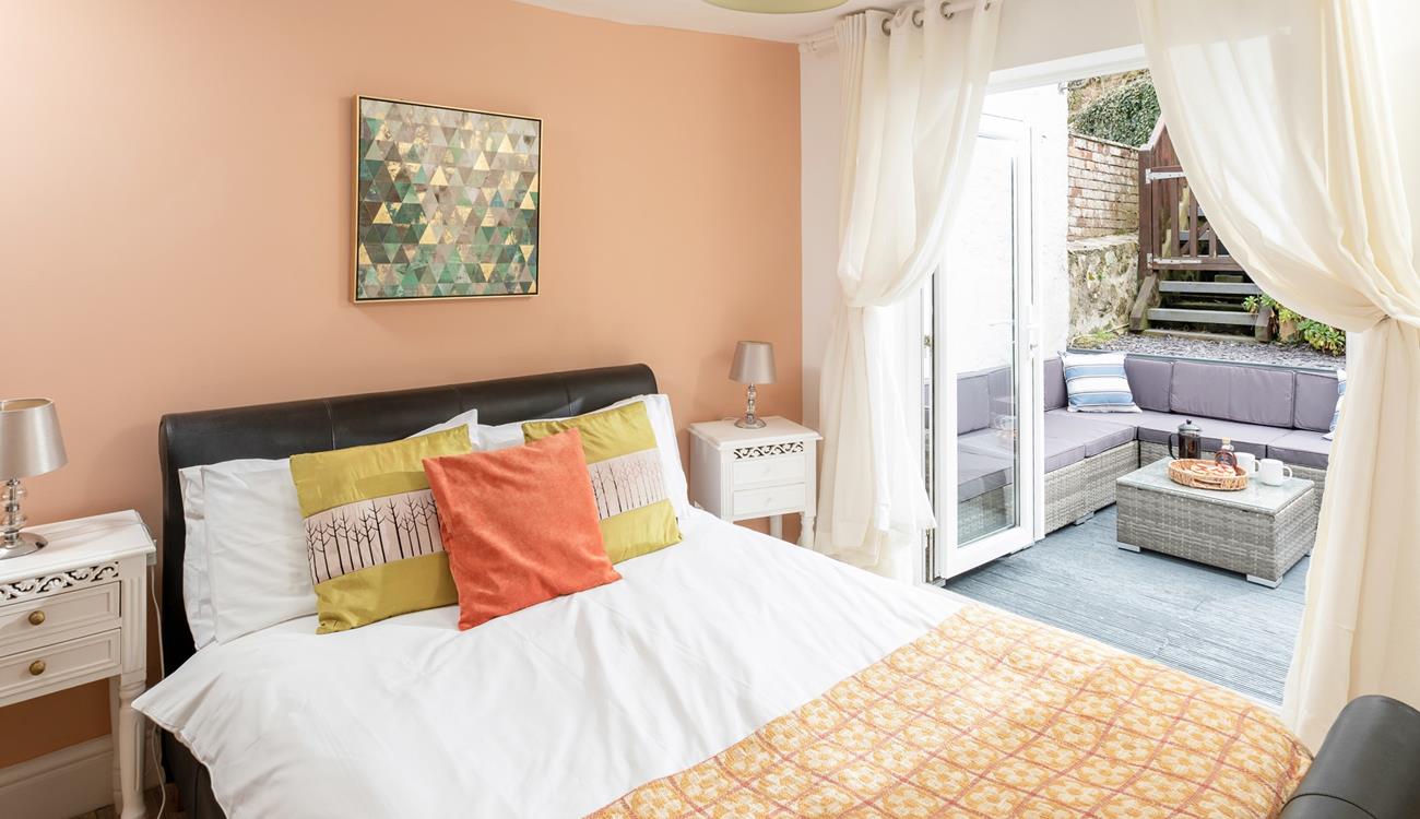 Bedroom 4 has patio doors out to the garden, perfect for a morning coffee in the sun!