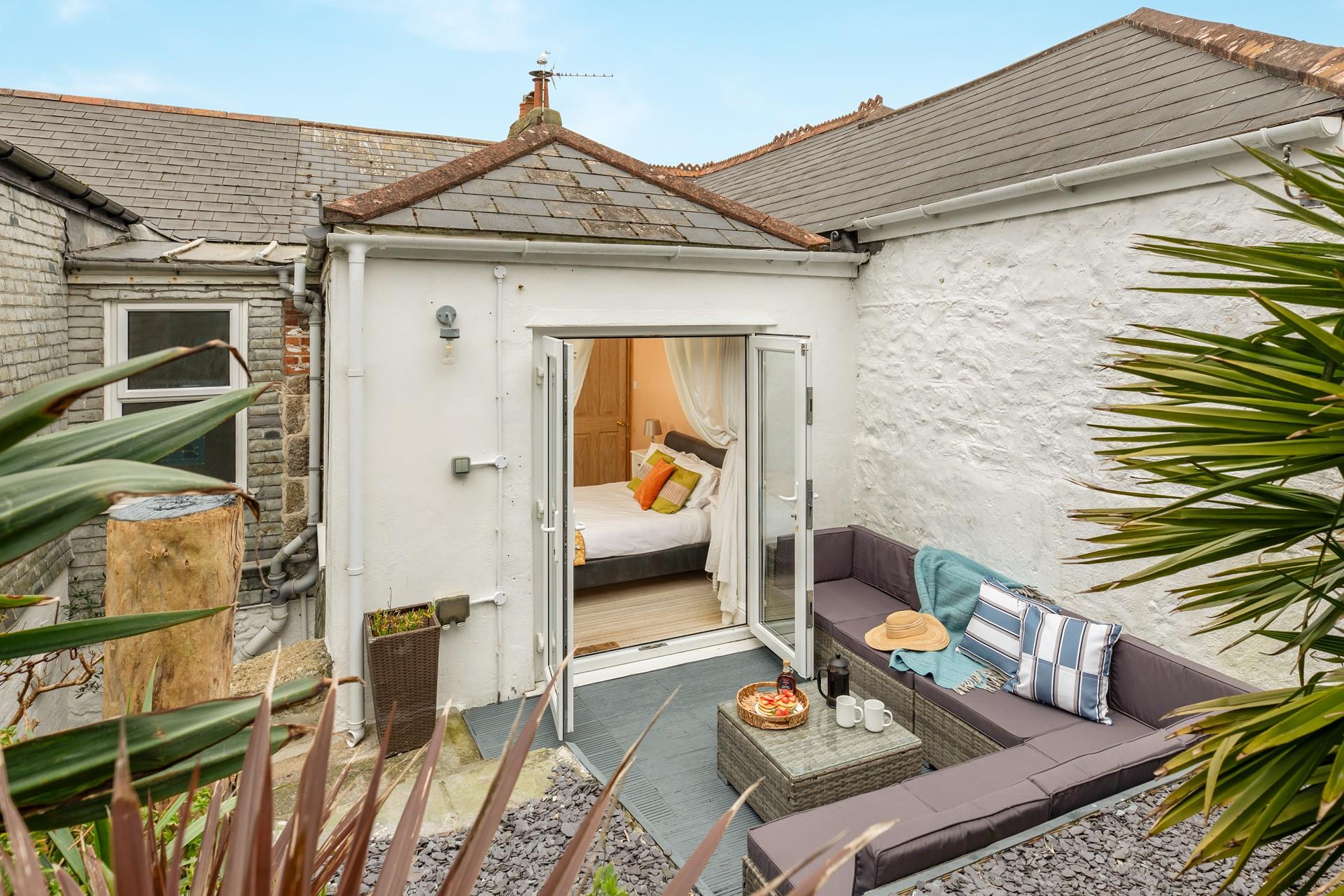 Step from bedroom 4 onto the patio and sip your morning coffee.