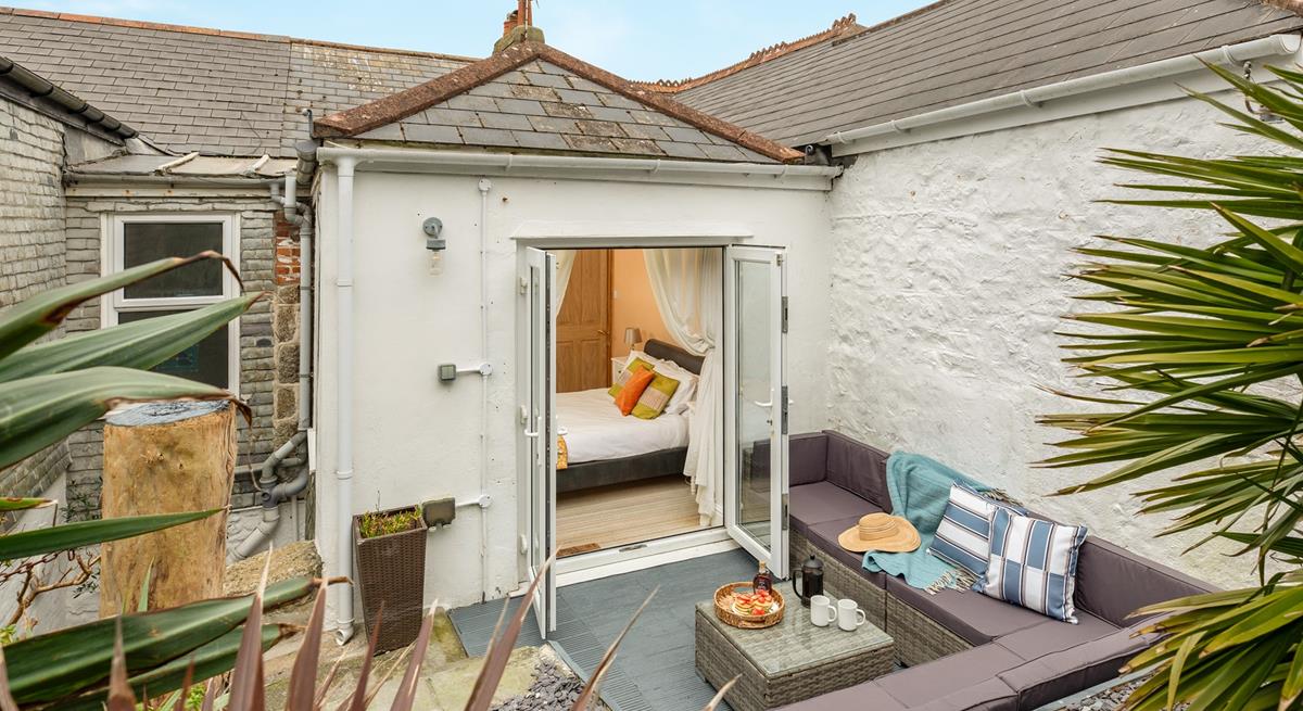 Step from bedroom 4 onto the patio and sip your morning coffee.