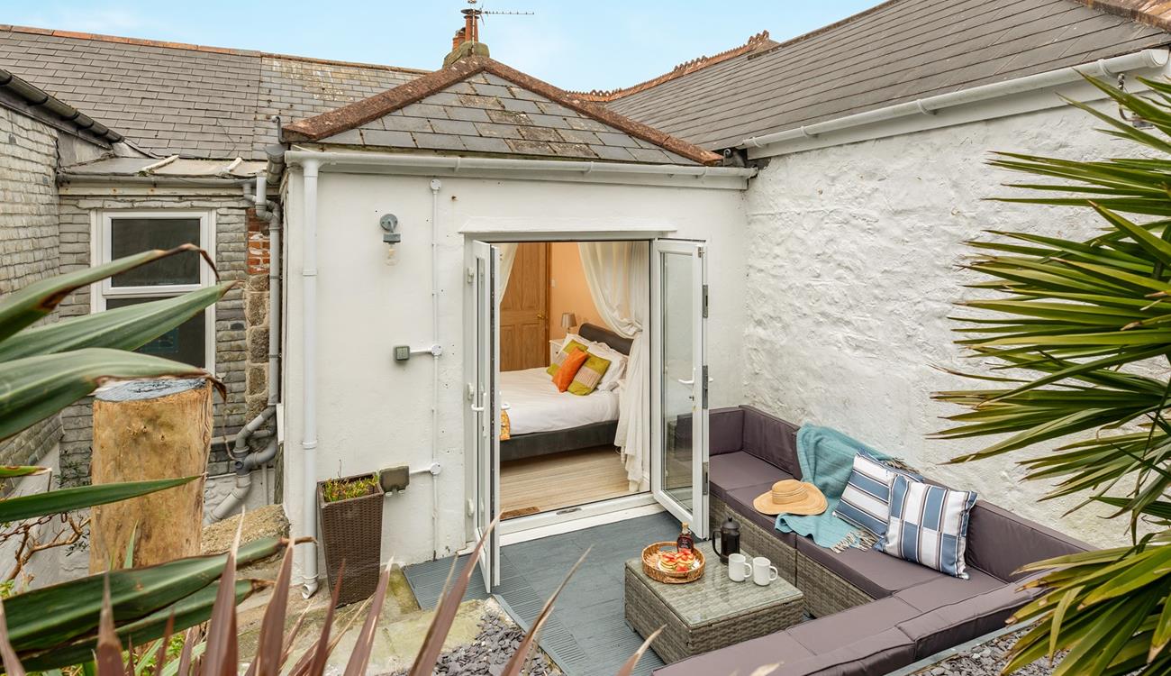 Step from bedroom 4 onto the patio and sip your morning coffee.