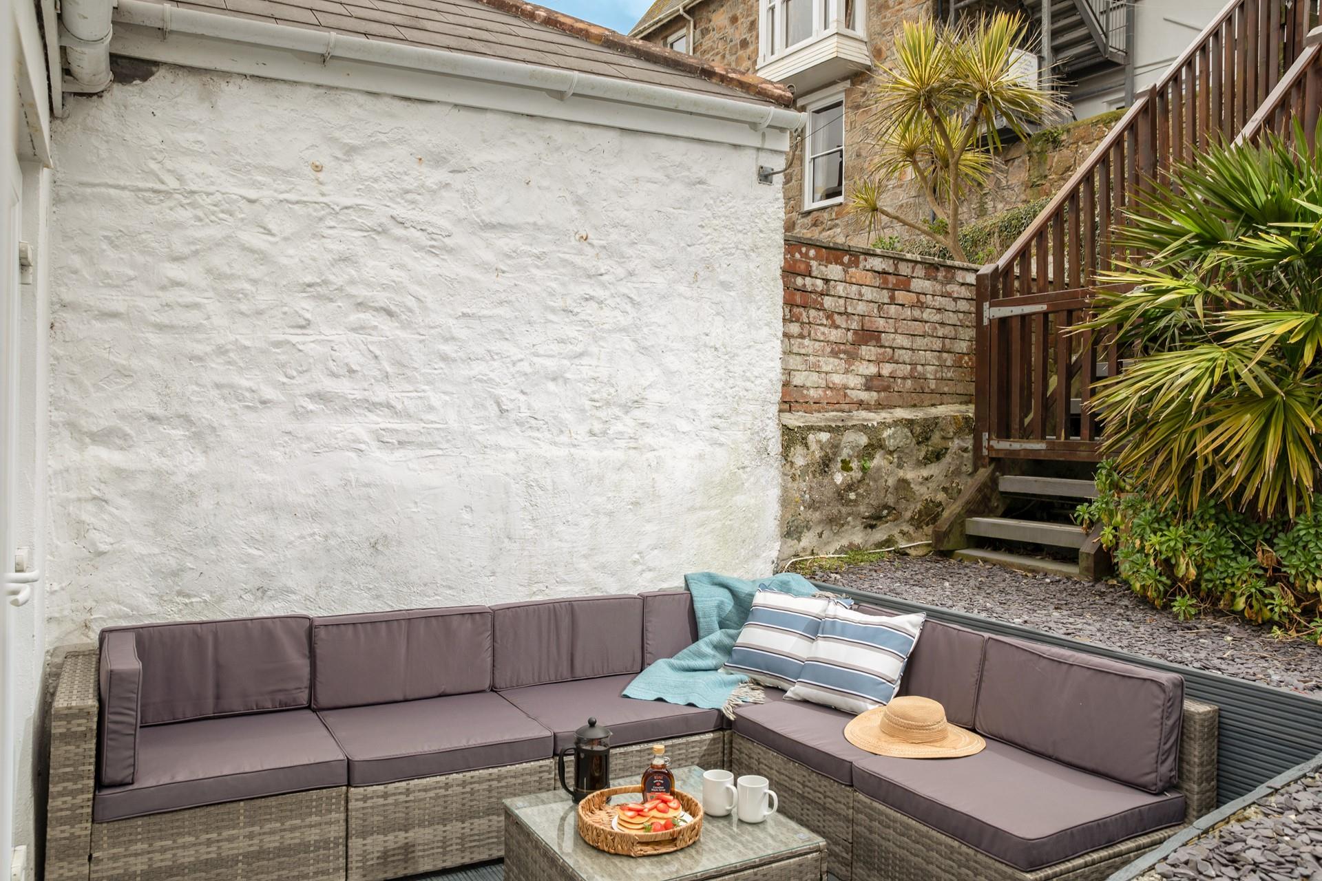 Head from the patio to the elevated decking for a moment of calm.