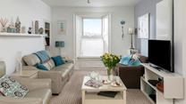 Relax in the sitting room enjoying gorgeous views over the harbour.