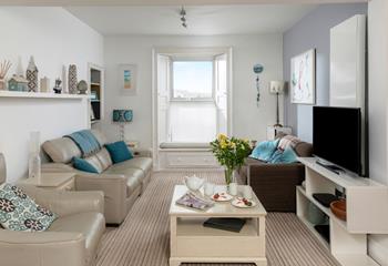 Relax in the sitting room enjoying gorgeous views over the harbour.