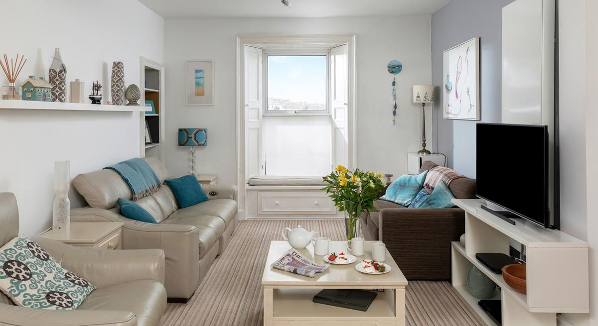 Relax in the sitting room enjoying gorgeous views over the harbour.