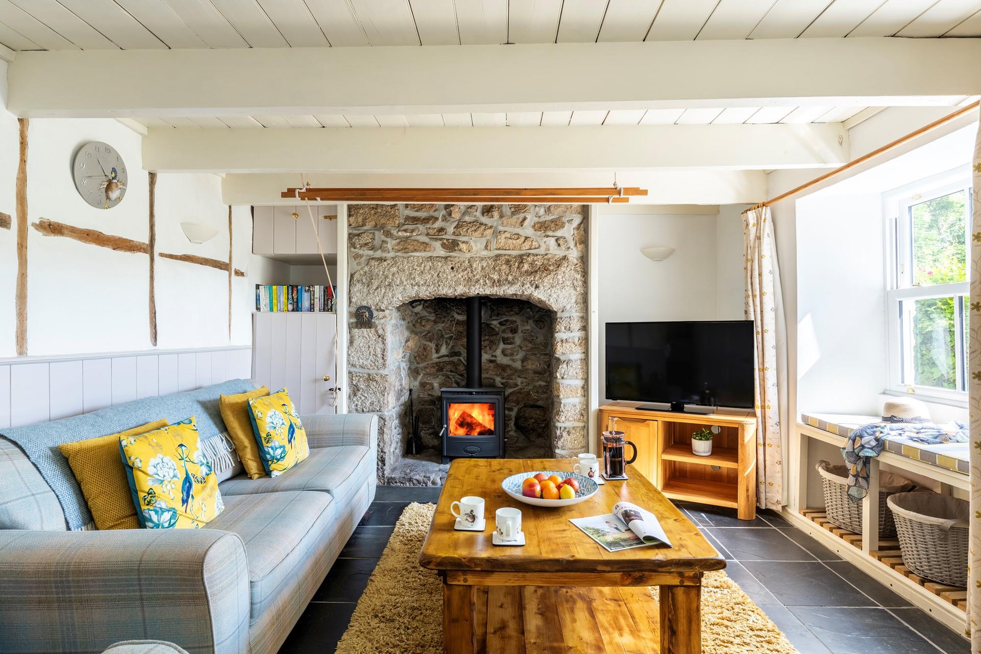 After a day walking the coast path relax in front of the cosy woodburner with a good film on the TV.