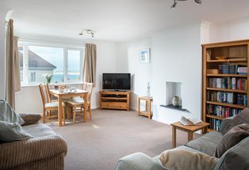 Light and airy, the spacious sitting room benefits from gorgeous sea views.