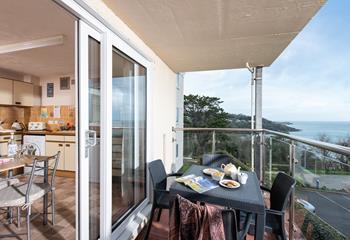 Slide open the patio doors from the kitchen and step out onto the balcony, where meals can be enjoyed al fresco, overlooking the fantastic view. 