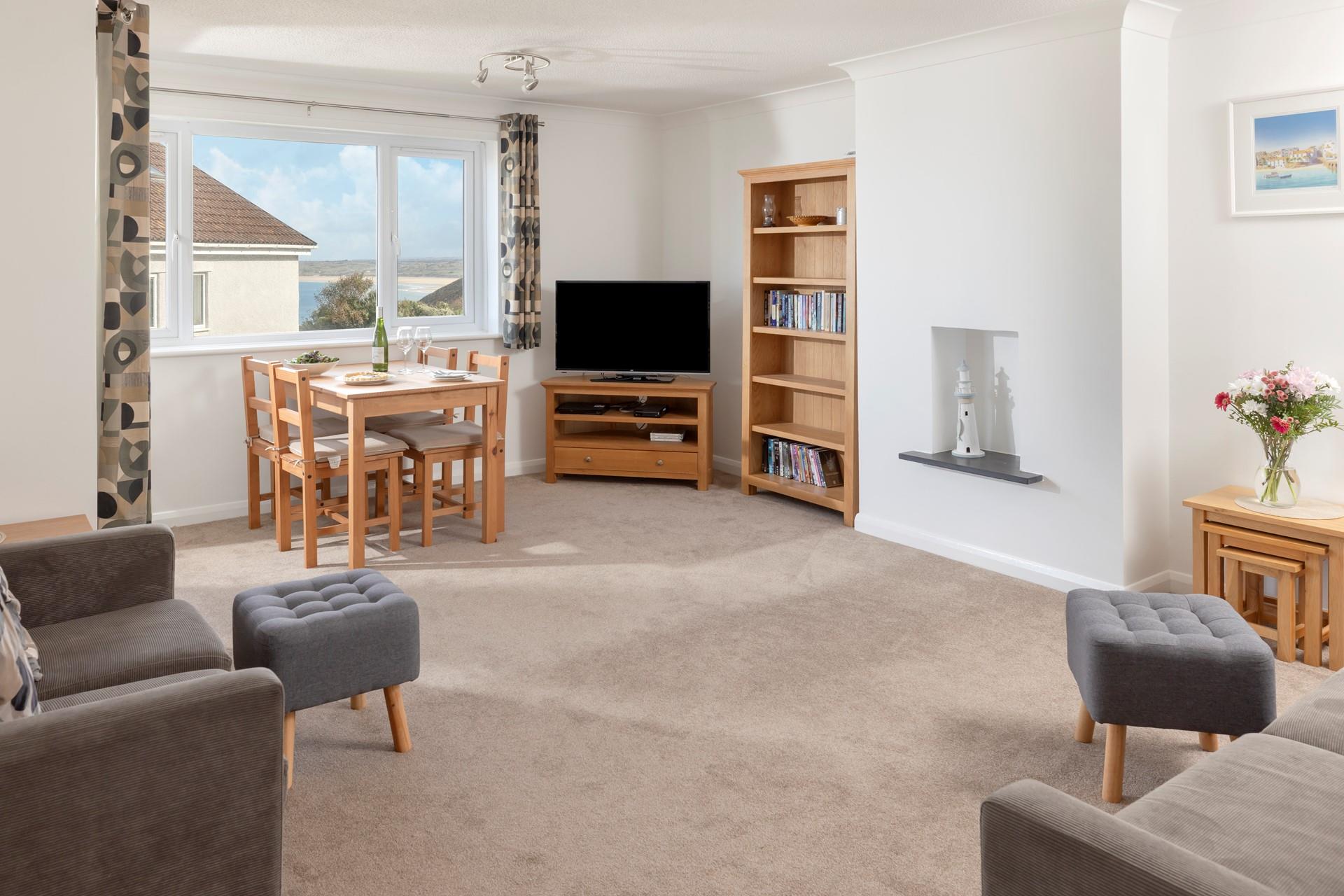 Light and airy, the spacious sitting room benefits from gorgeous sea views.
