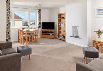 Light and airy, the spacious sitting room benefits from gorgeous sea views.
