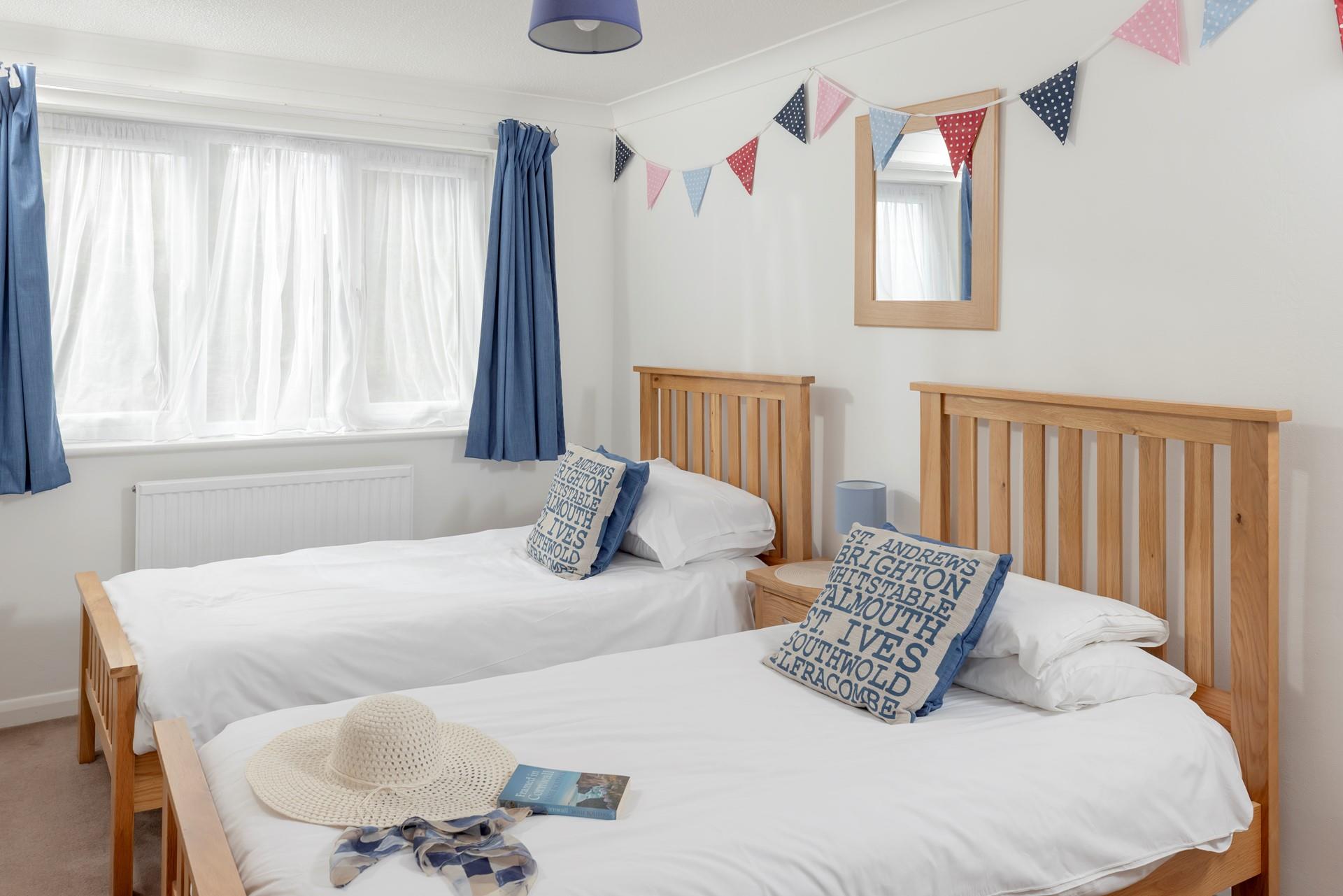 Bright and colourful, bedroom 2 is perfect for two children sharing. We love the bunting!