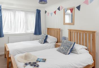 Bright and colourful, bedroom 2 is perfect for two children sharing. We love the bunting!