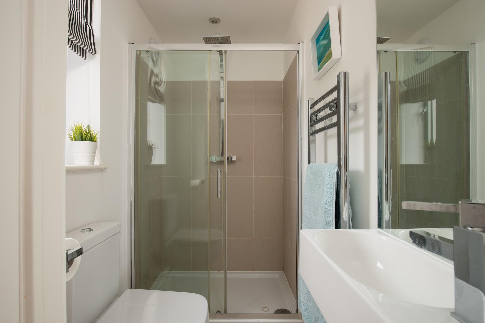 The en-suite shower room from the master bedroom offers an invigorating shower to start your day.