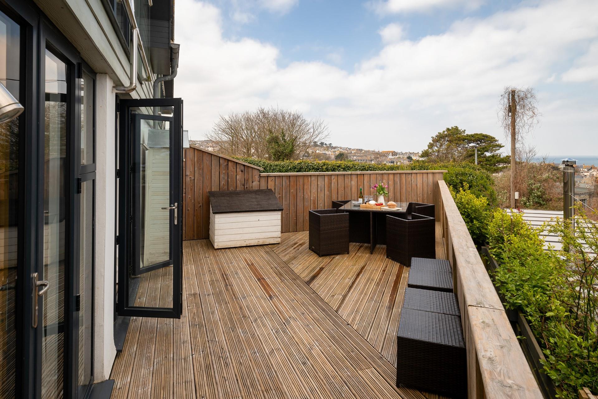 Wander out to the decking and enjoy a cold glass of wine.