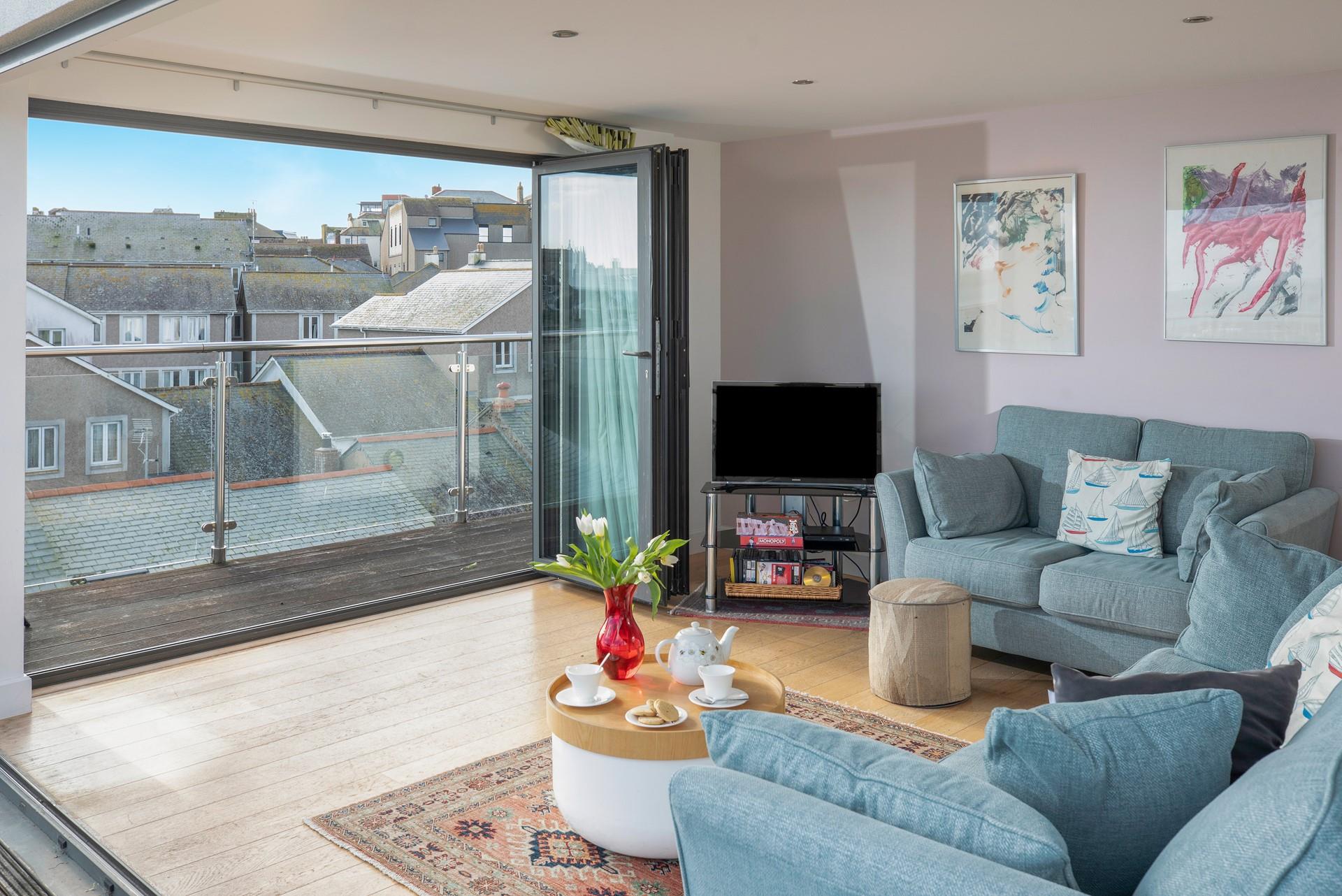 Sink into the comfortable sofa and soak up the sea air.