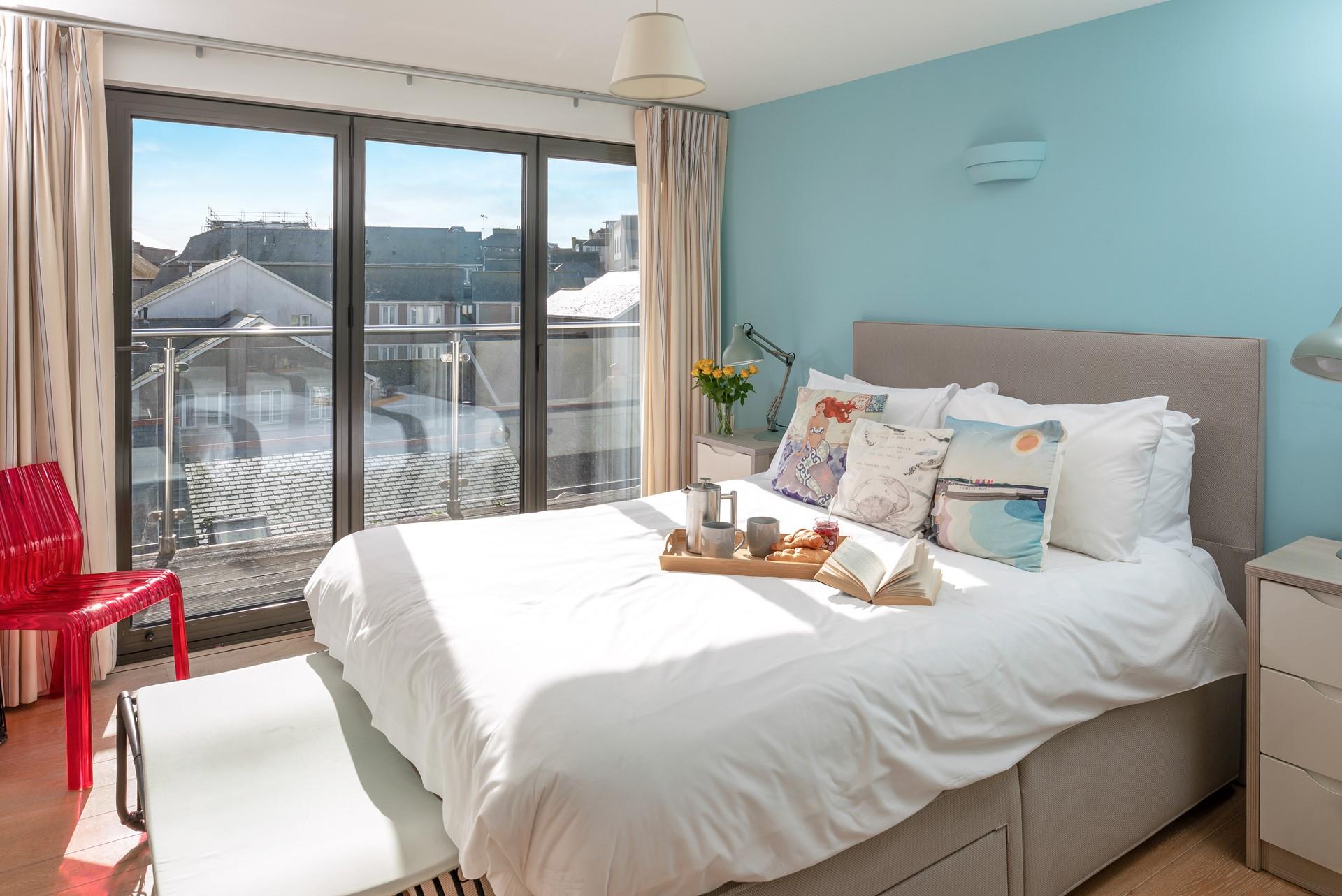 Bedroom 2 has a kingsize bed and door leading out onto the balcony. 