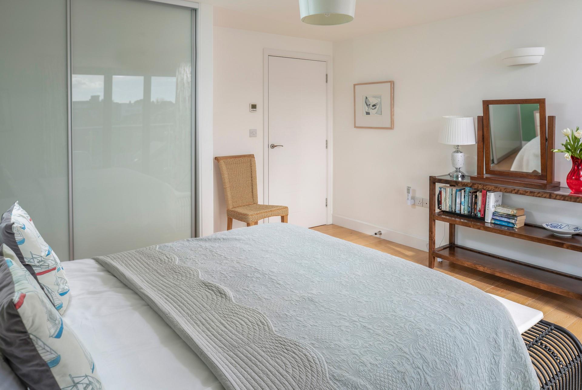 The bedroom is spacious and filled with light.