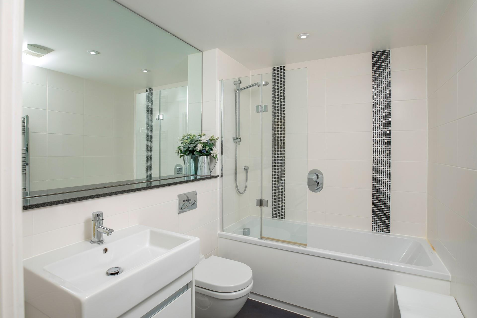 The main bathroom has a bath and overhead shower.