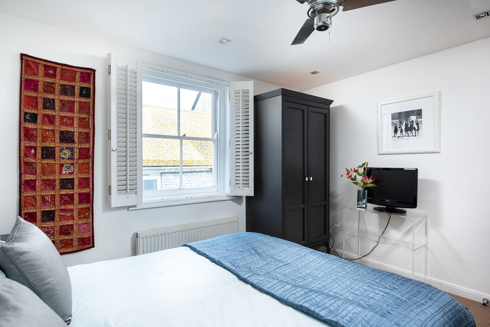 Settle into bed with a good film on the TV.