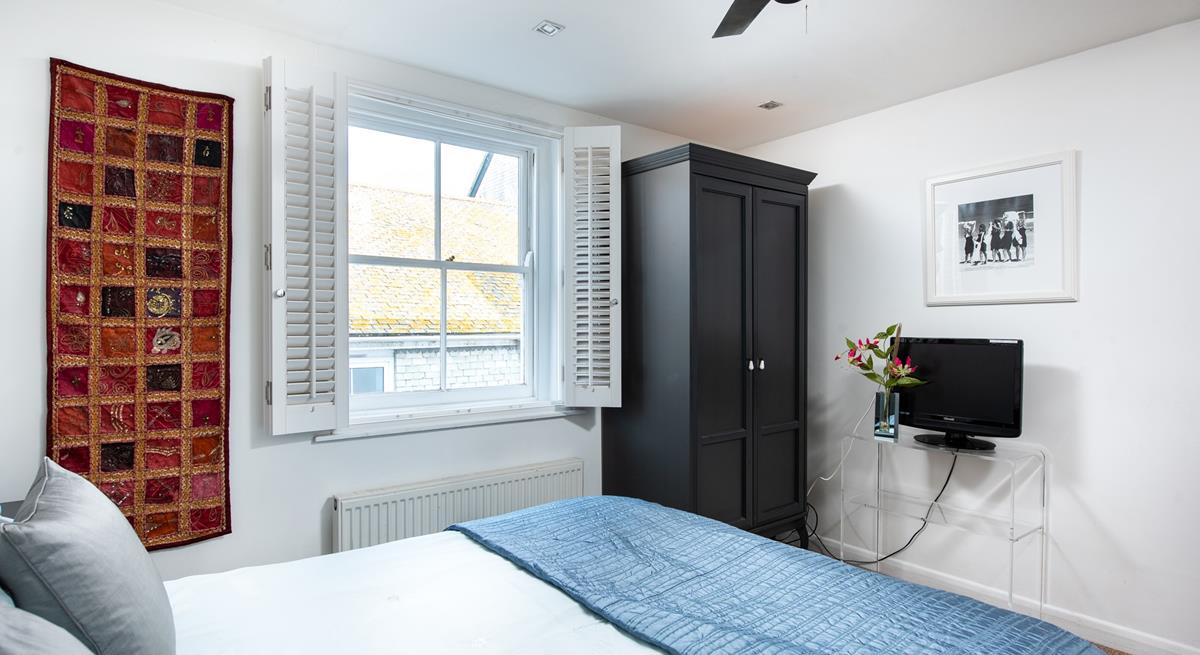 Settle into bed with a good film on the TV.