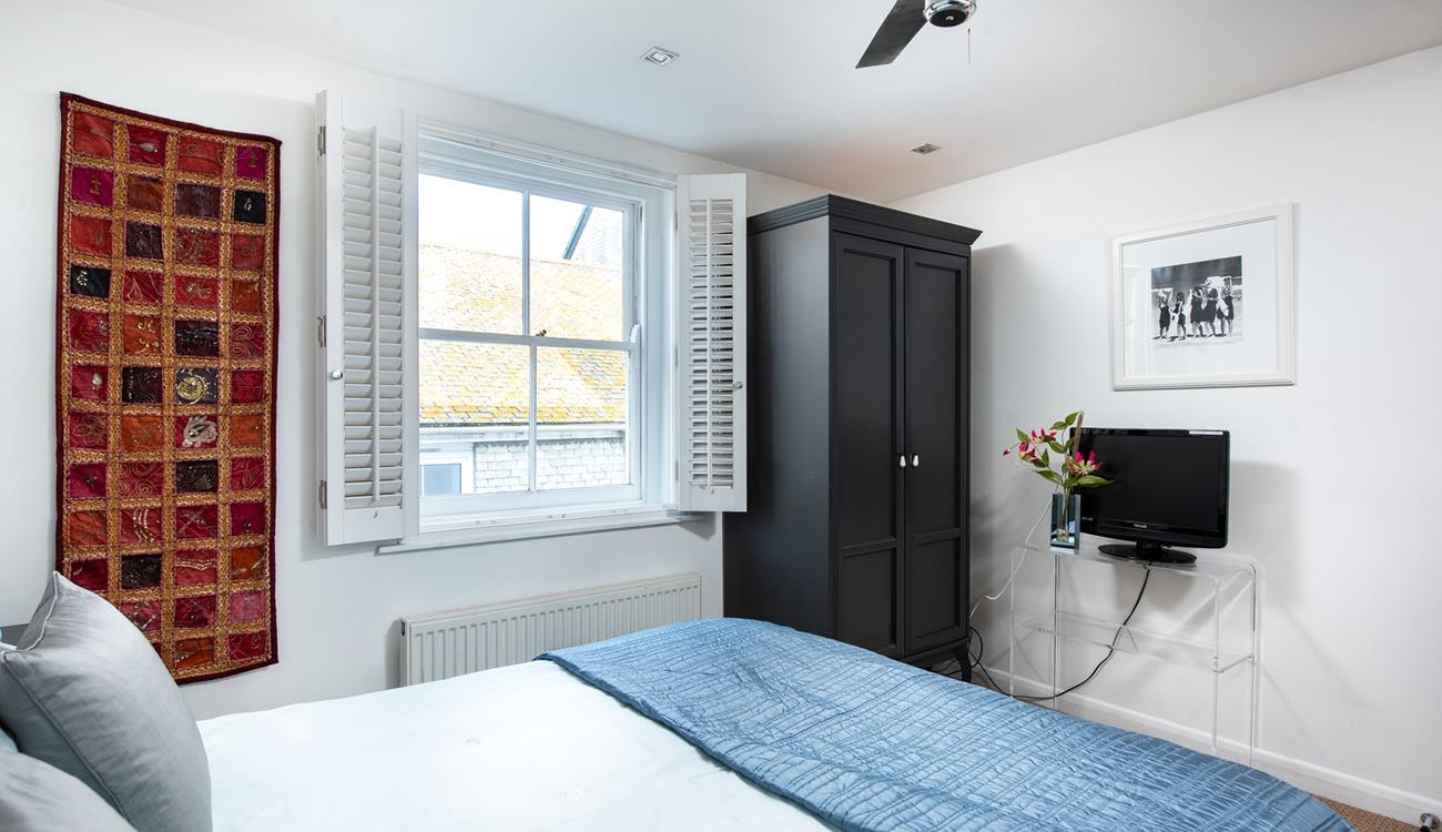 Settle into bed with a good film on the TV.