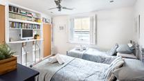 The twin bedroom provides a space for the kids to sleep, exhausted after a day on the beach.