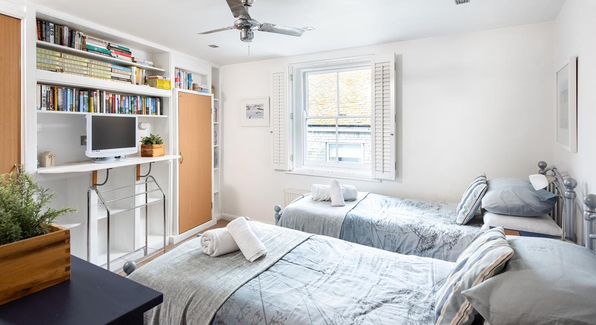 The twin bedroom provides a space for the kids to sleep, exhausted after a day on the beach.