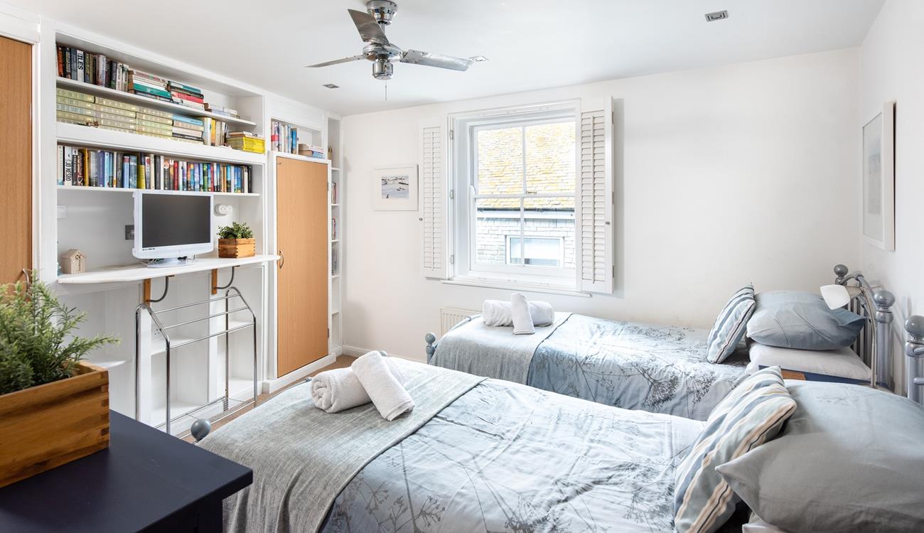 The twin bedroom provides a space for the kids to sleep, exhausted after a day on the beach.