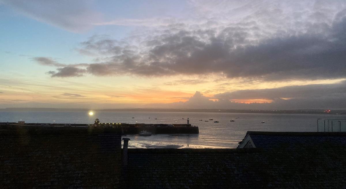 Watch the sunset over the harbour to end the day.