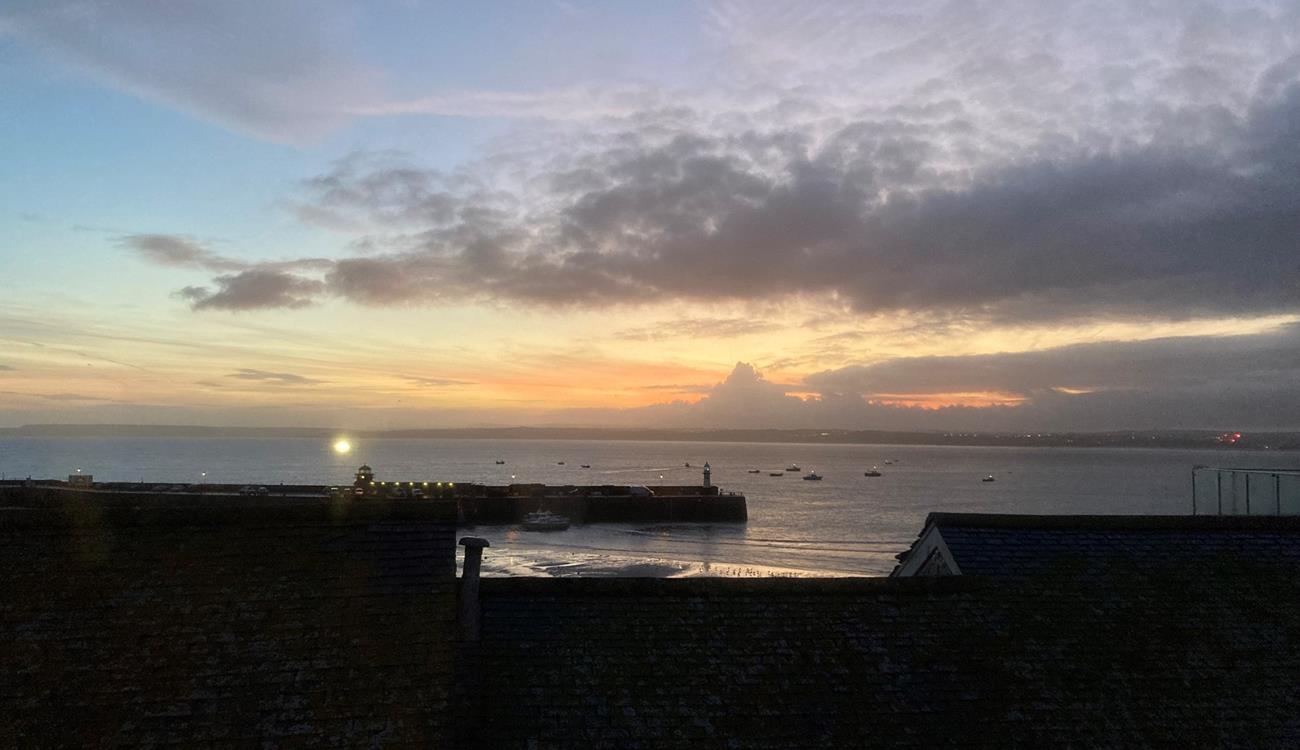 Watch the sunset over the harbour to end the day.