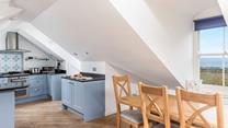 The light and airy open plan living area provides space for all the family.