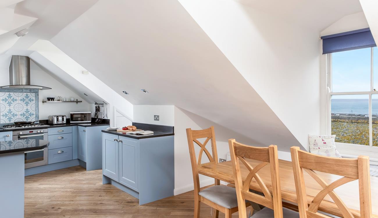 The light and airy open plan living area provides space for all the family.