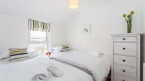 Twin beds with crisp white linen are perfect for children!