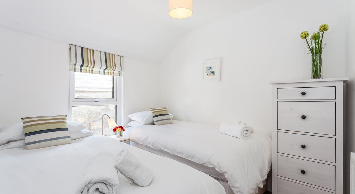 Twin beds with crisp white linen are perfect for children!
