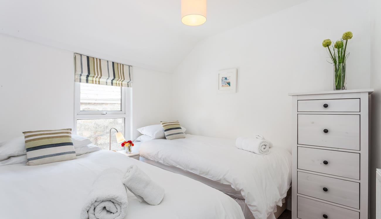 Twin beds with crisp white linen are perfect for children!