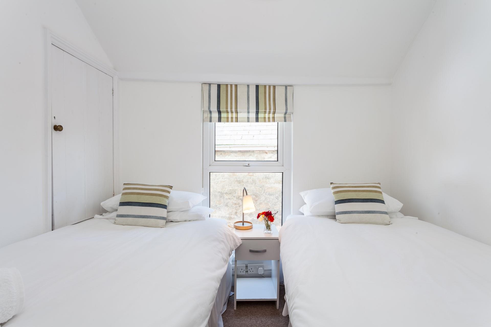 Tuck the kids in for a peaceful night's sleep in this lovely twin room.