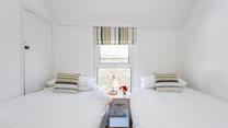 Tuck the kids in for a peaceful night's sleep in this lovely twin room.