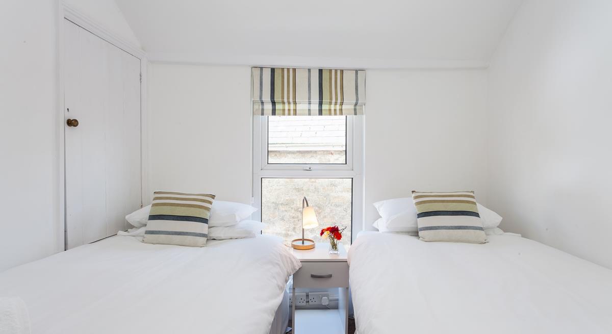 Tuck the kids in for a peaceful night's sleep in this lovely twin room.
