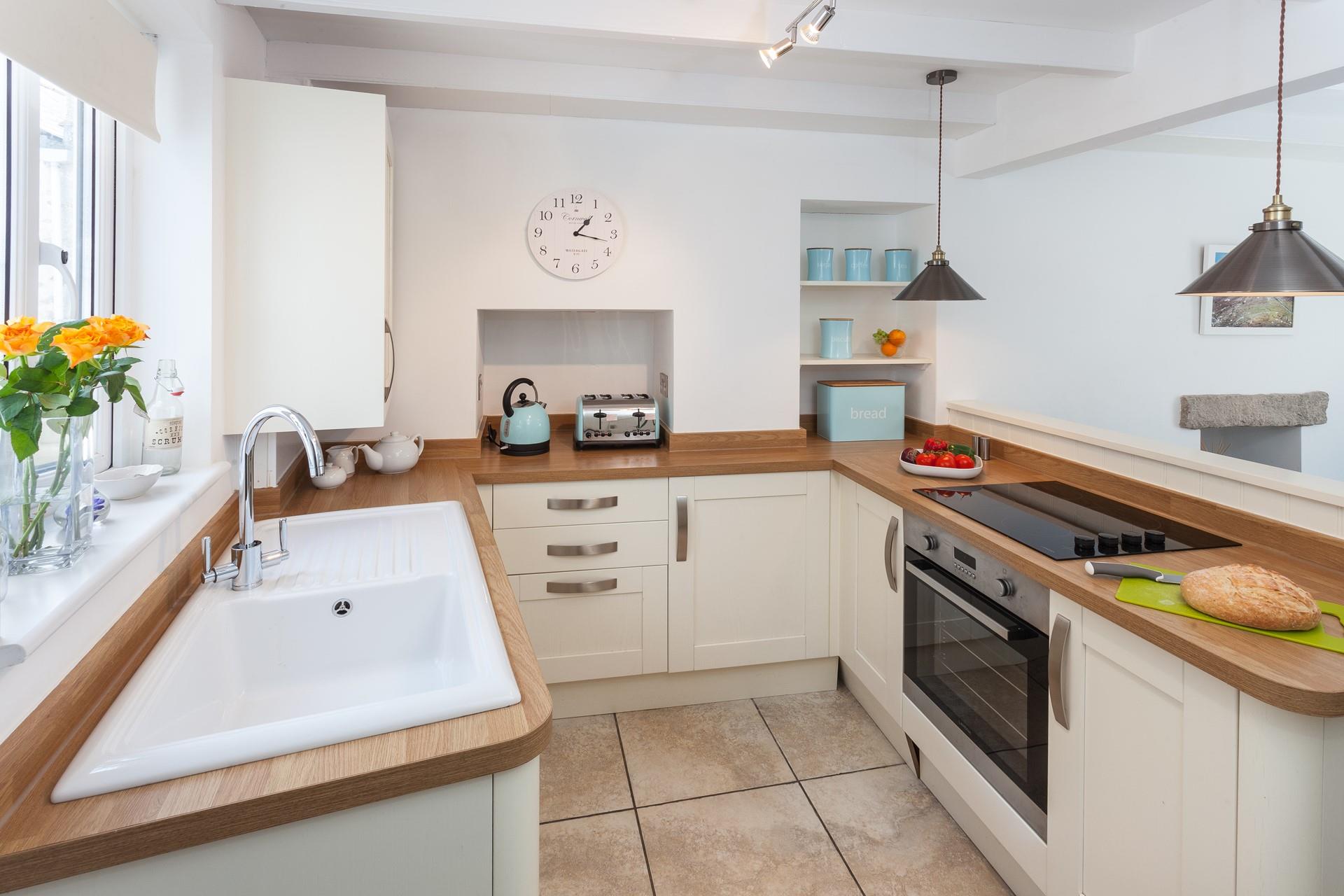 The charming kitchen has a distinct country style whilst still being packed with modern appliances.