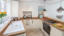 The charming kitchen has a distinct country style whilst still being packed with modern appliances.