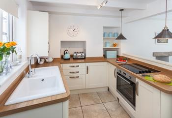 The charming kitchen has a distinct country style whilst still being packed with modern appliances.