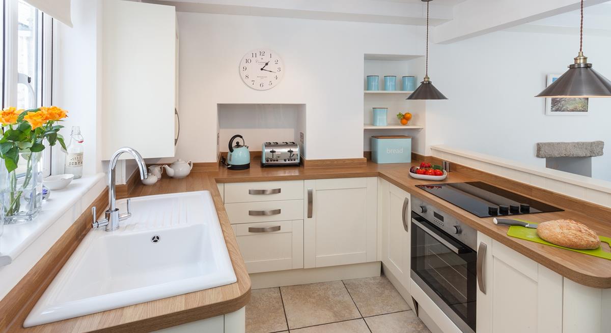 The charming kitchen has a distinct country style whilst still being packed with modern appliances.