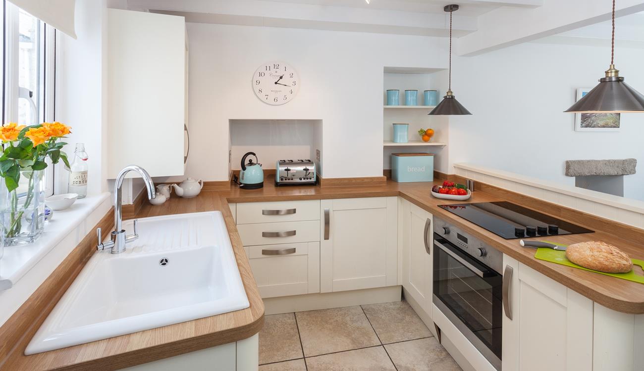 The charming kitchen has a distinct country style whilst still being packed with modern appliances.
