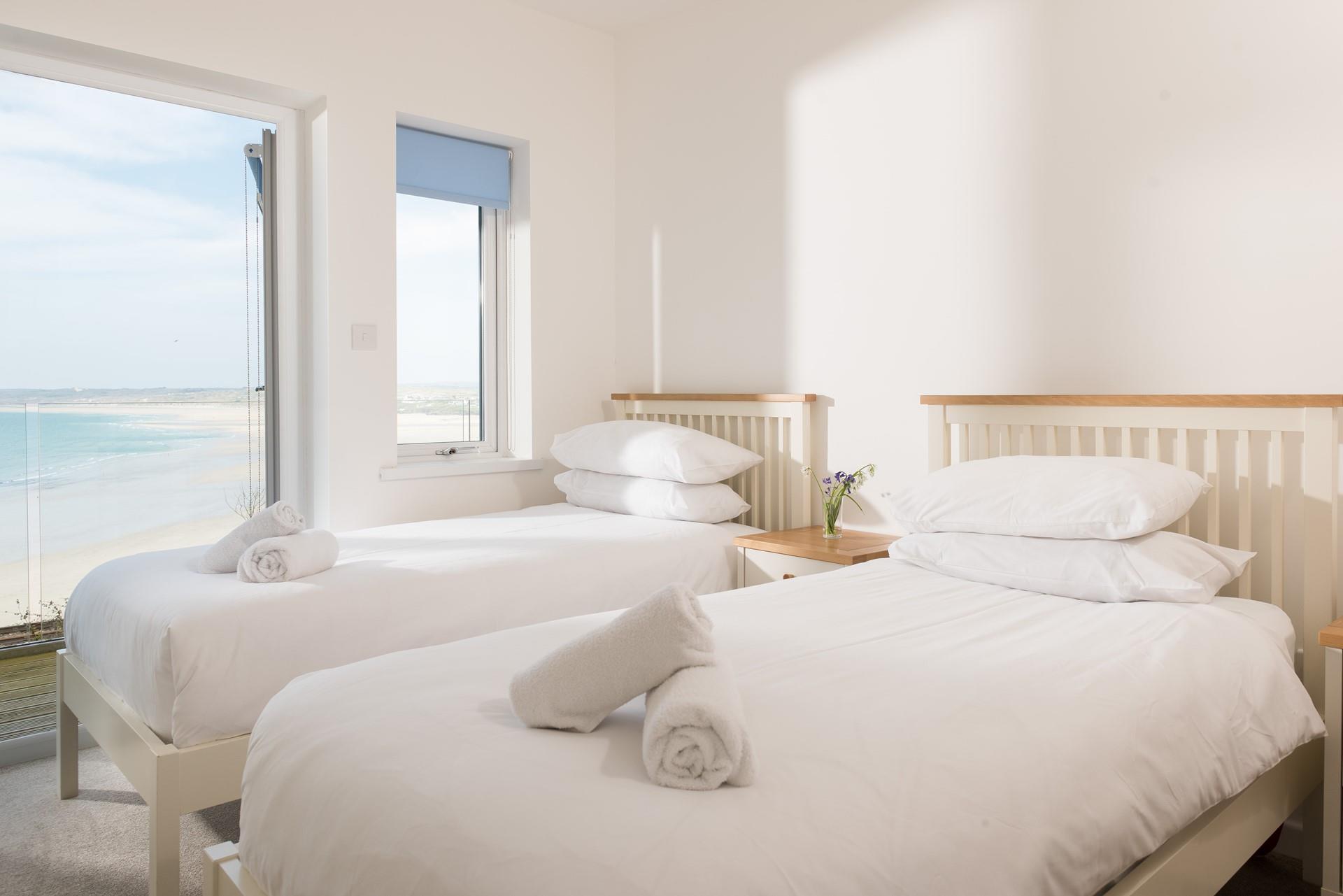 Step from the light and airy twin bedroom onto the balcony. 