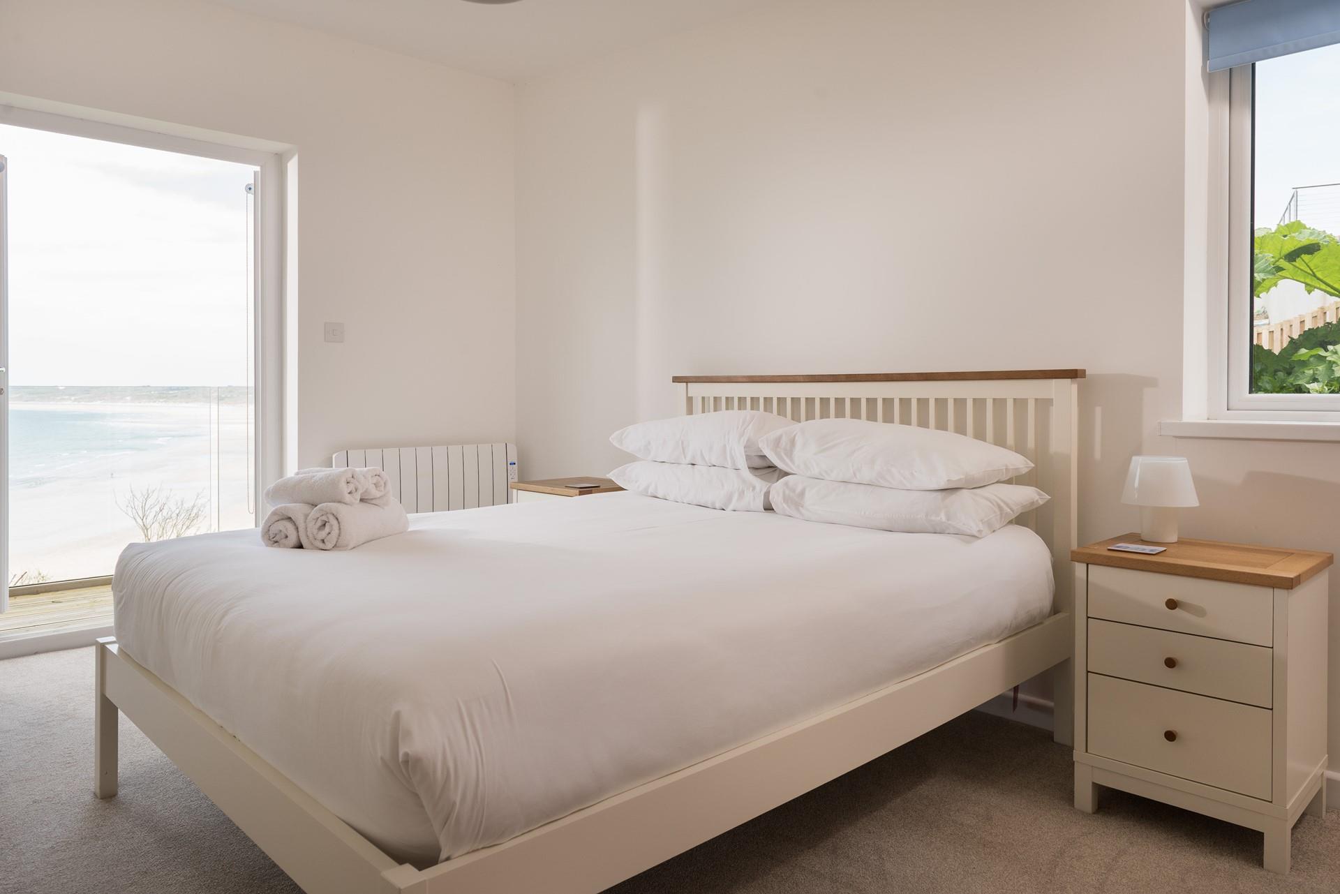 Relax into soft white linen and plump pillows.