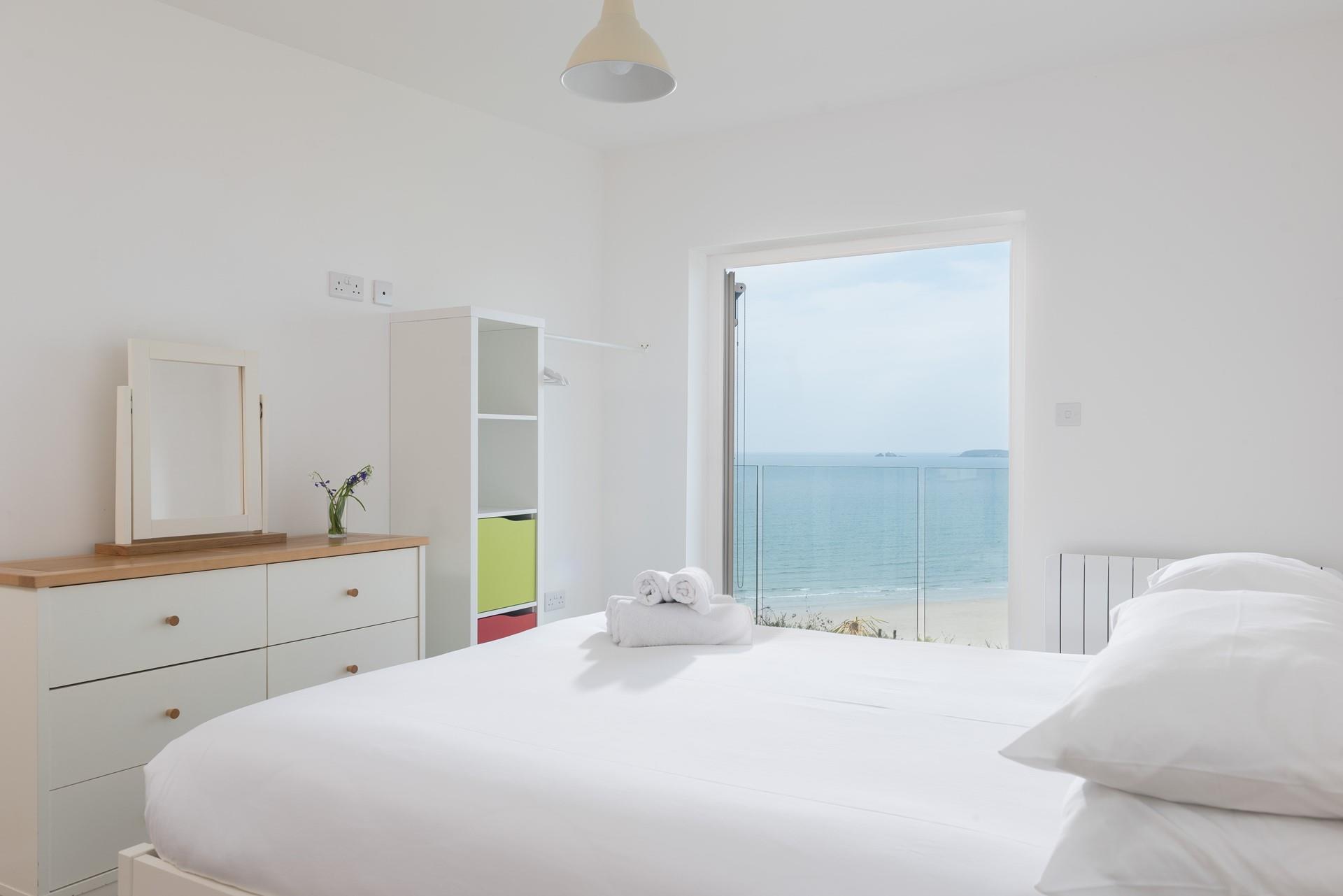 Indulge in a relaxing morning in the sun-dappled king size bed, enjoying a cuppa while admiring the view. 